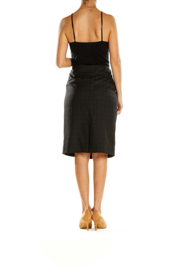 Side view of Classiques Entier black plaid wrap pencil skirt showing button accents