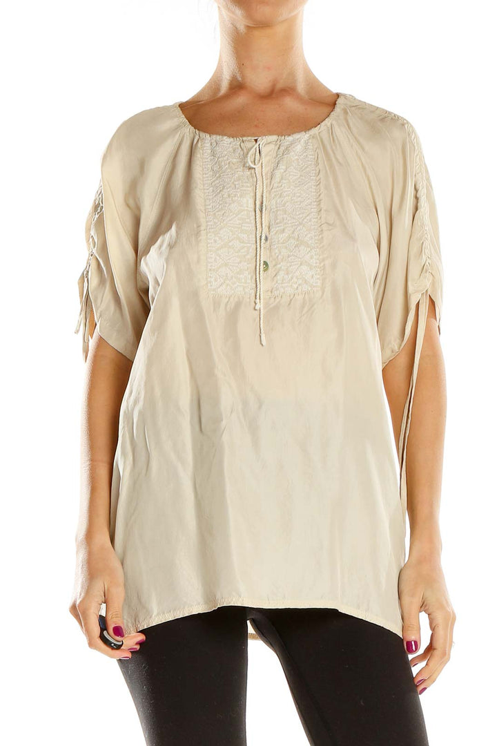Front view of beige Banana Republic peasant blouse with embroidery