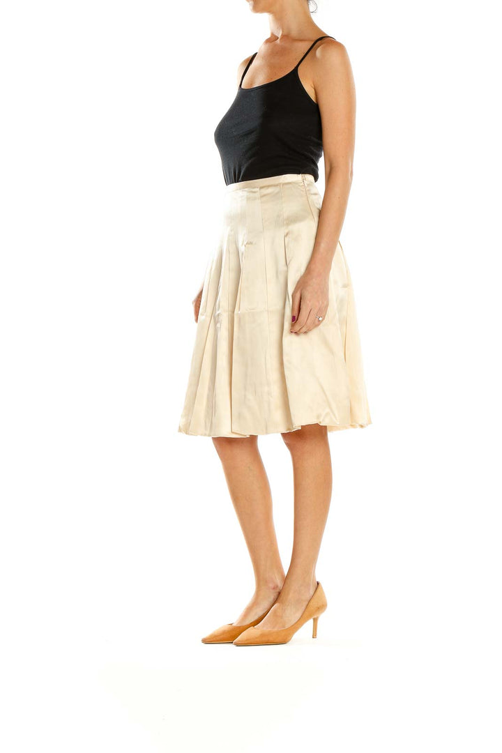 Front view of cream pleated A-line midi skirt by Maxazria Collection