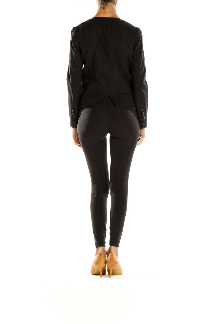 Side view of Marc By Marc Jacobs black blazer showing tailored fit and length