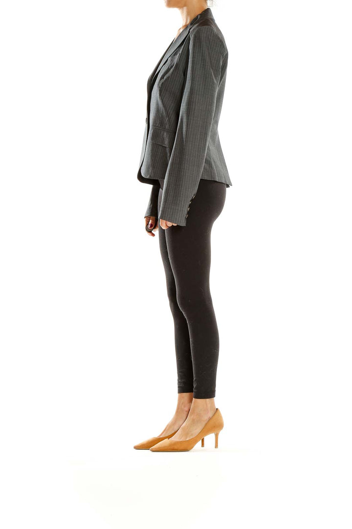 Front view of Theory gray pinstriped tailored blazer on model