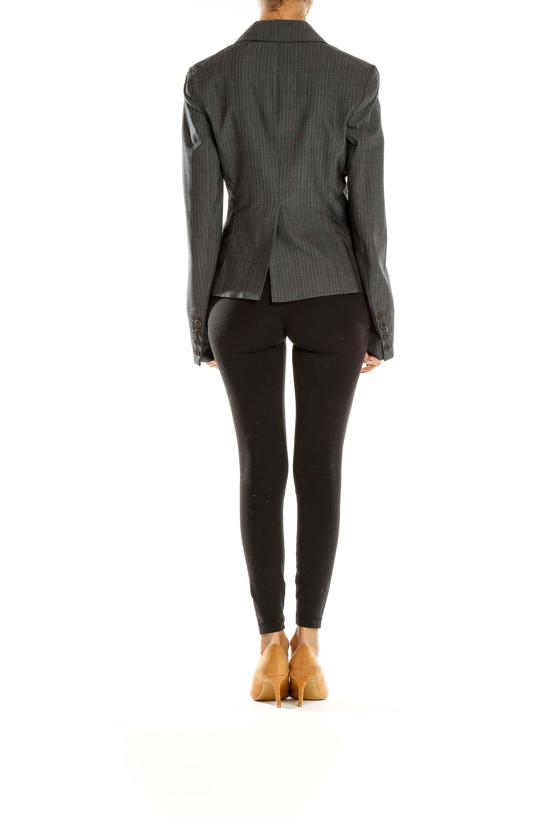 Side view of Theory gray pinstriped tailored blazer on model with black pants