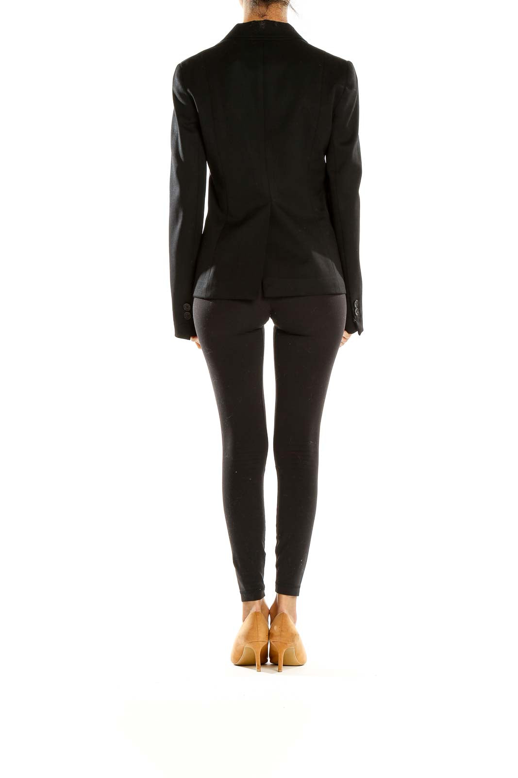 Side view of black Theory blazer showing tailored silhouette