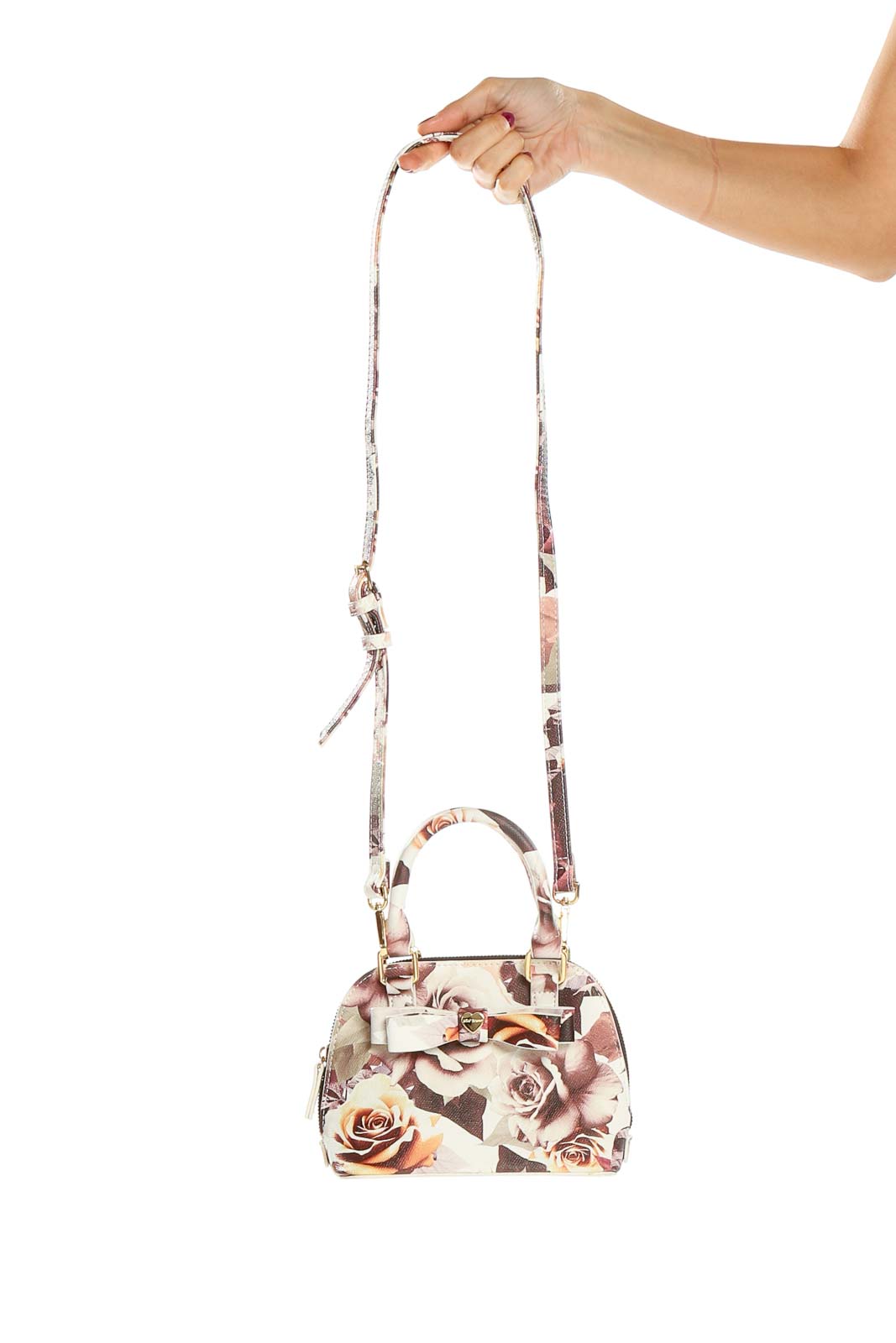 Front view of Betsy Johnson floral print mini crossbody bag with gold-tone hardware