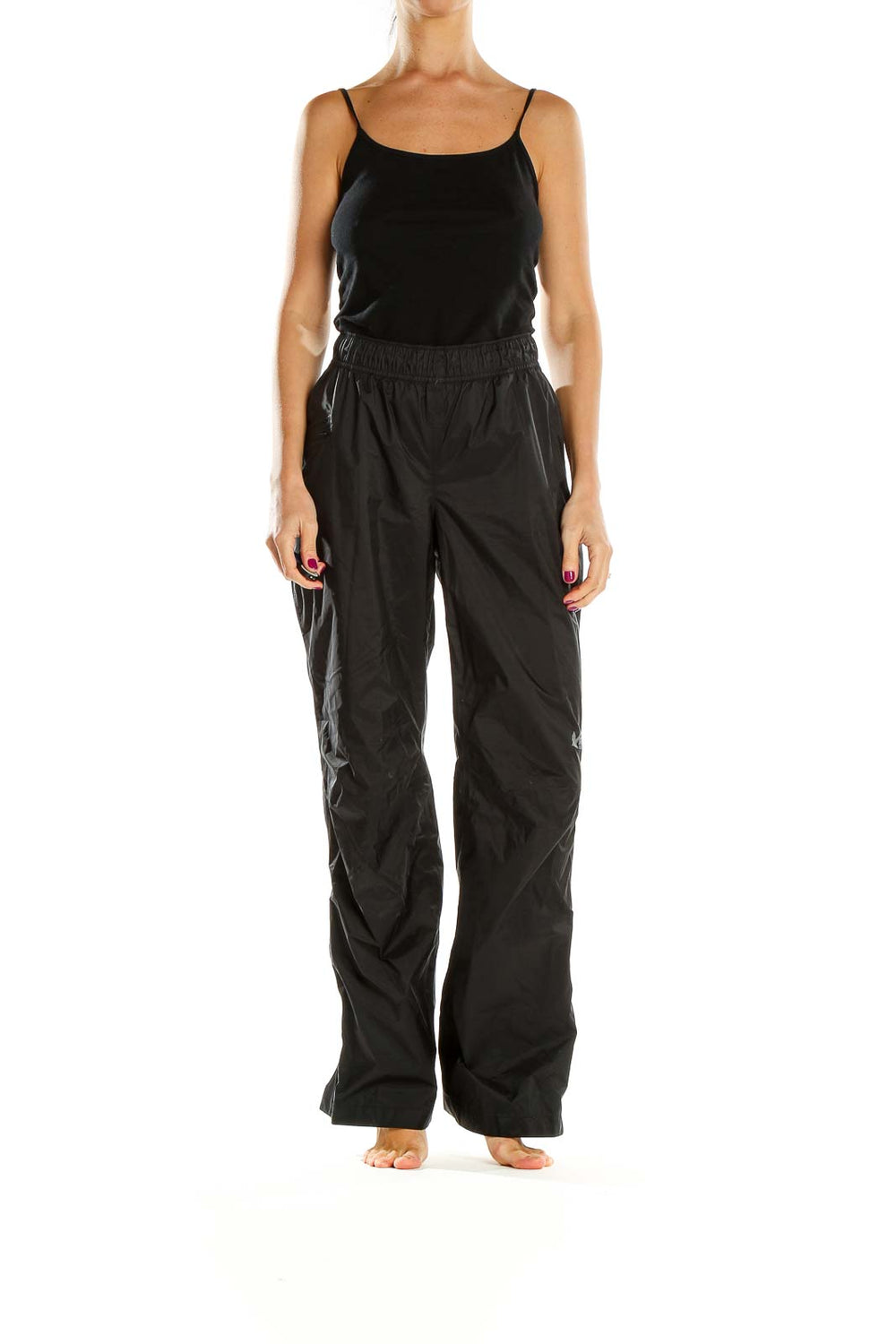 Front view of black REI hiking pants with elastic waistband