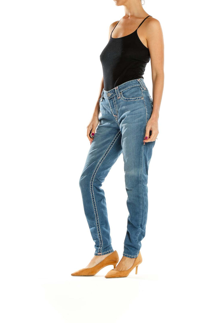 Front view of True Religion light blue straight leg jeans on model