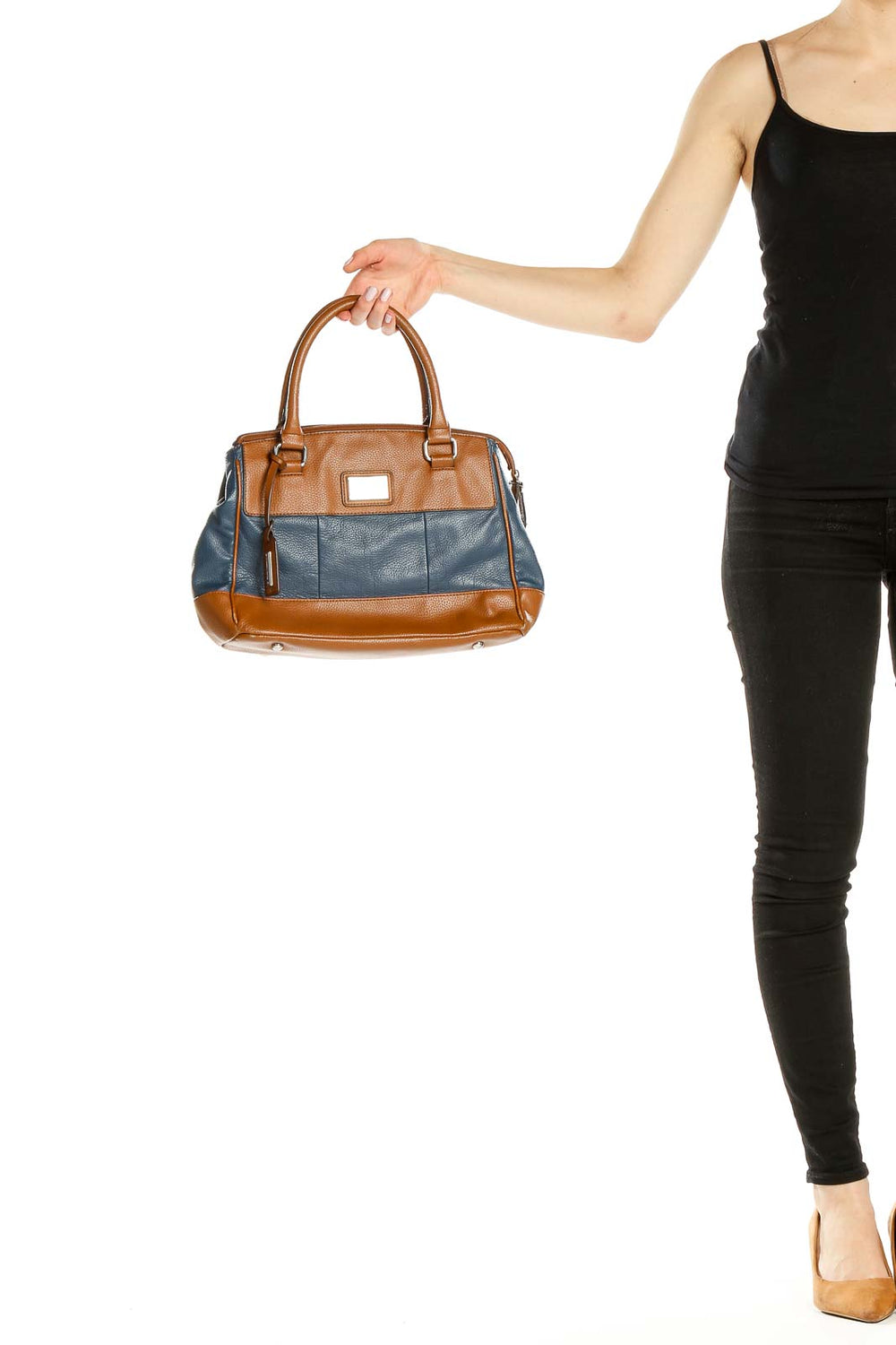 Front view of Tignanello brown and blue leather satchel held by hand