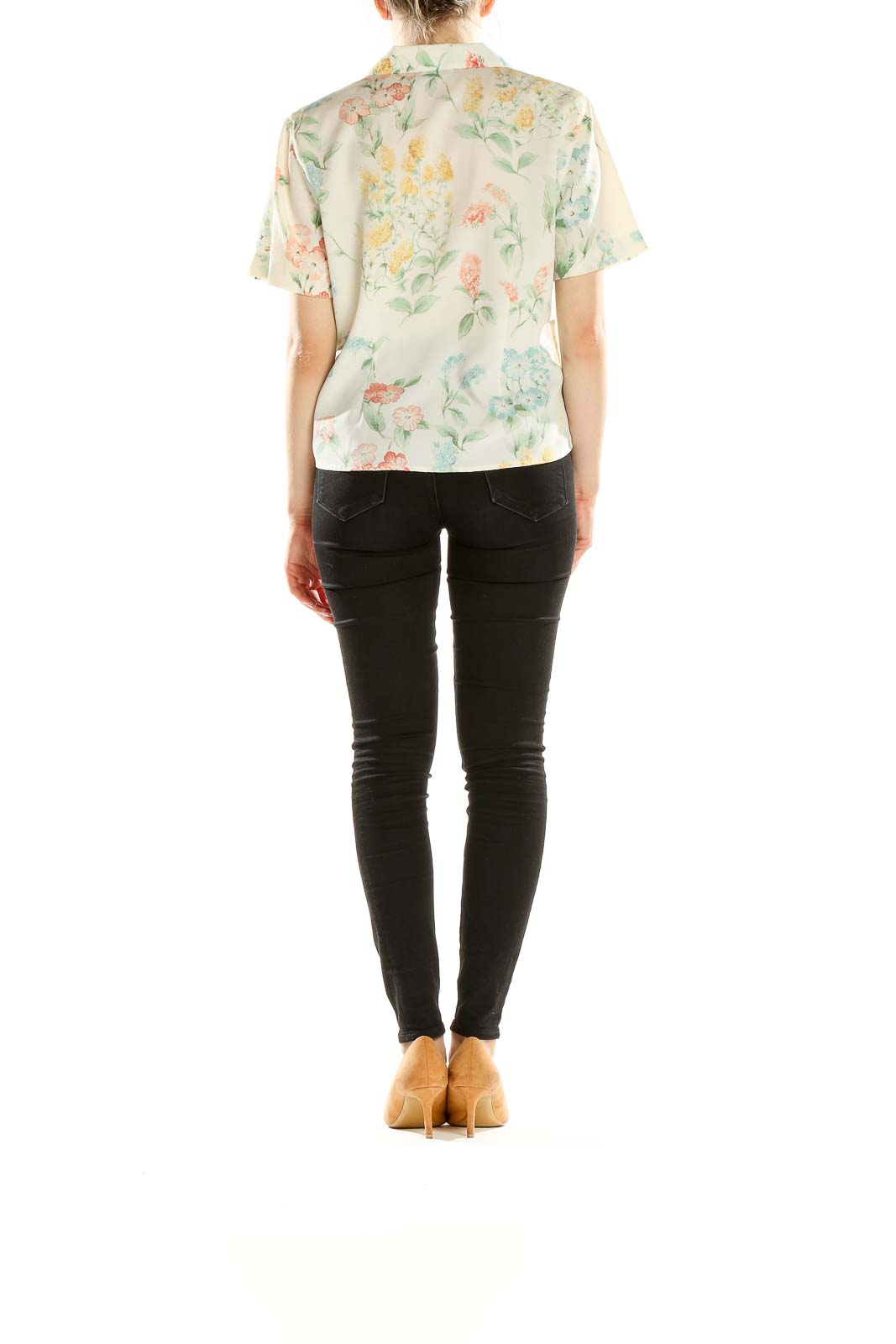Side view of model wearing Alfred Dunner cream floral blouse with black pants