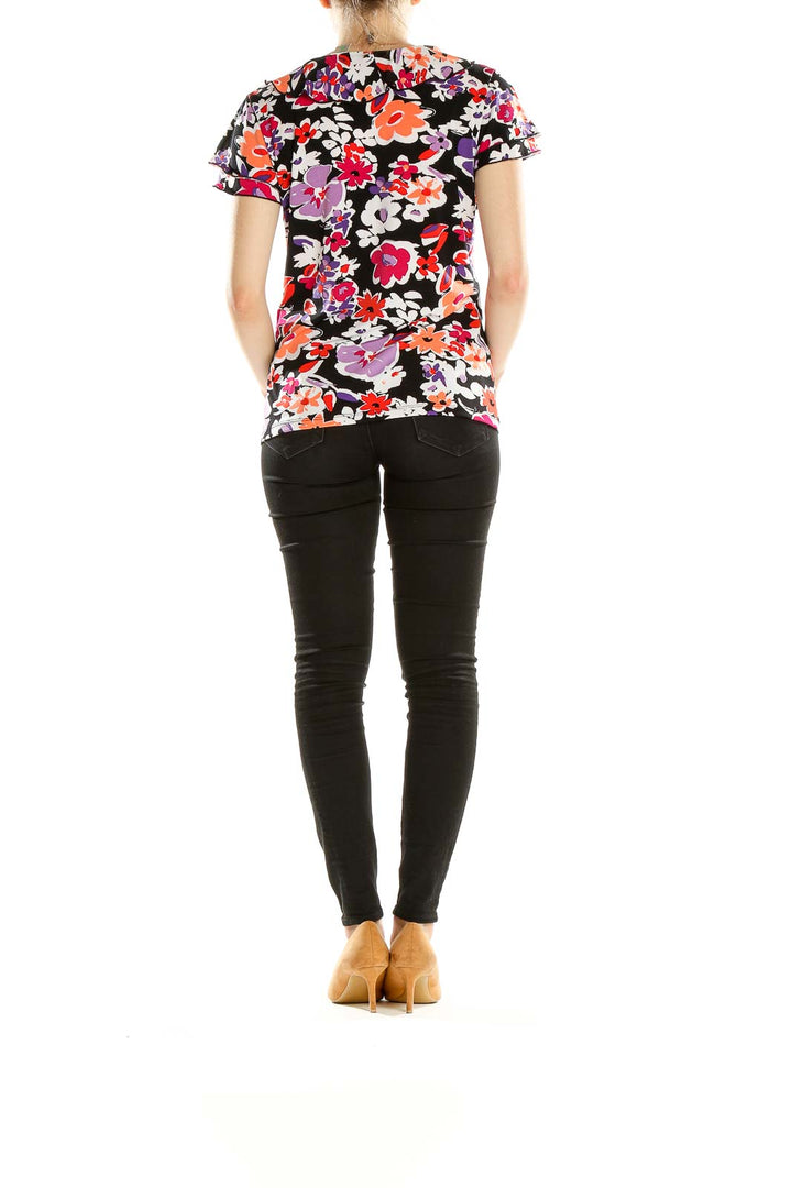 Back view of Laura Ashley multicolor floral print short sleeve top on model