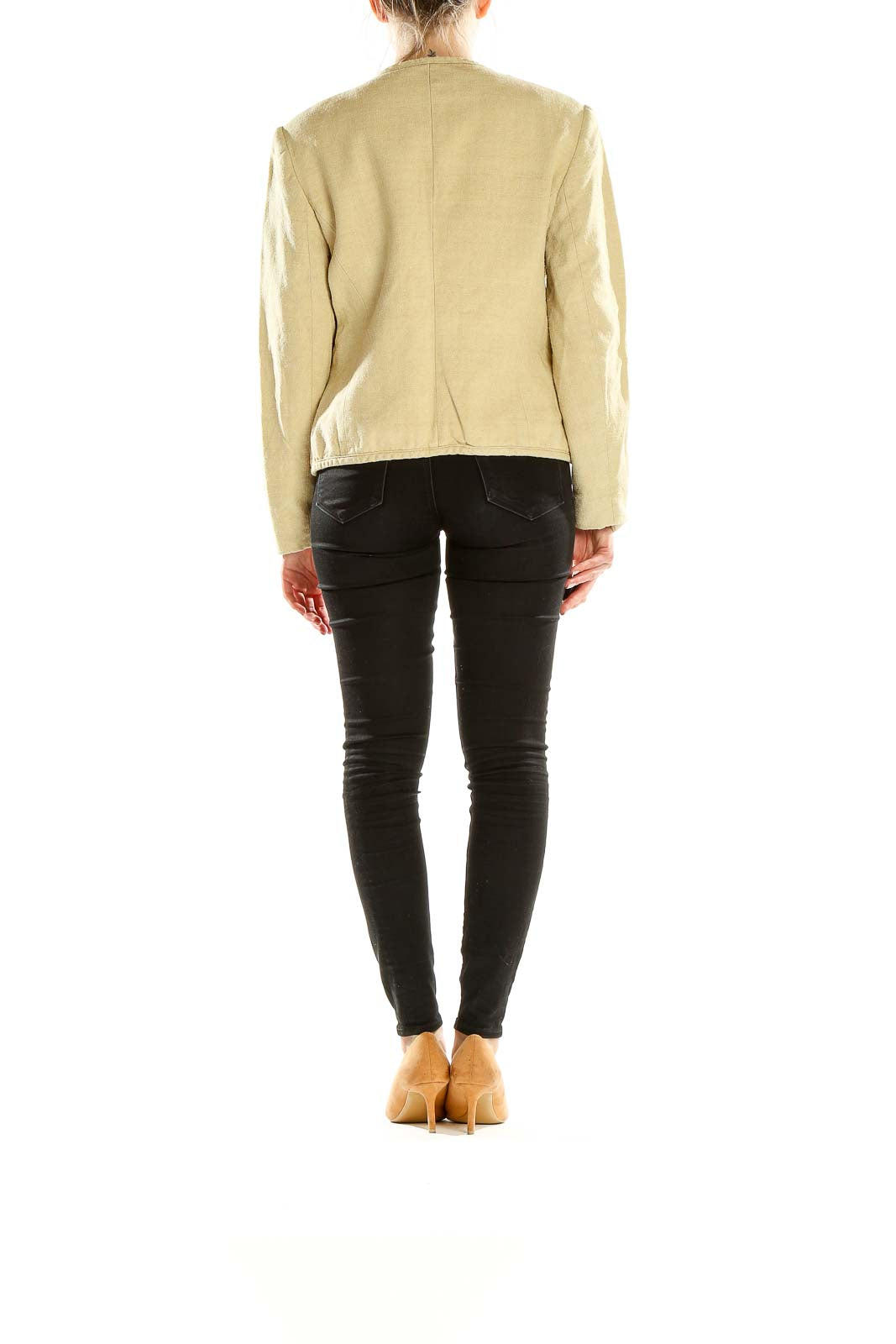 Back view of beige Orvis lightweight jacket on model with black pants