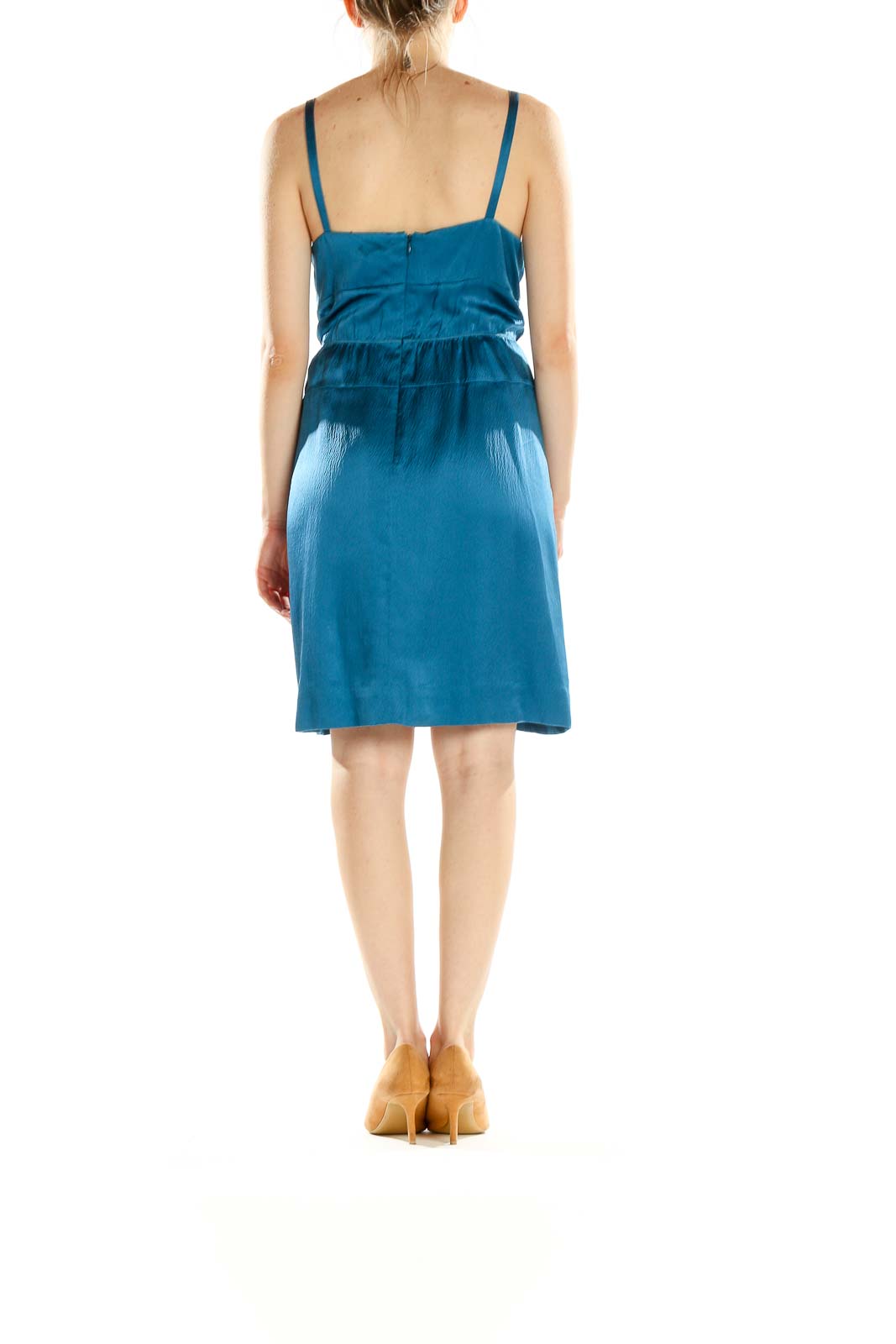 Side view of teal satin slip dress by J.Crew showing sleek silhouette