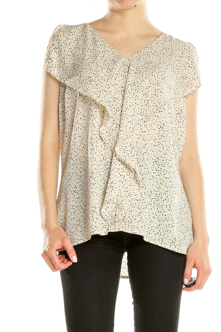 Front view of cream speckled IMNYC Isaac Mizrahi blouse with ruffle detail