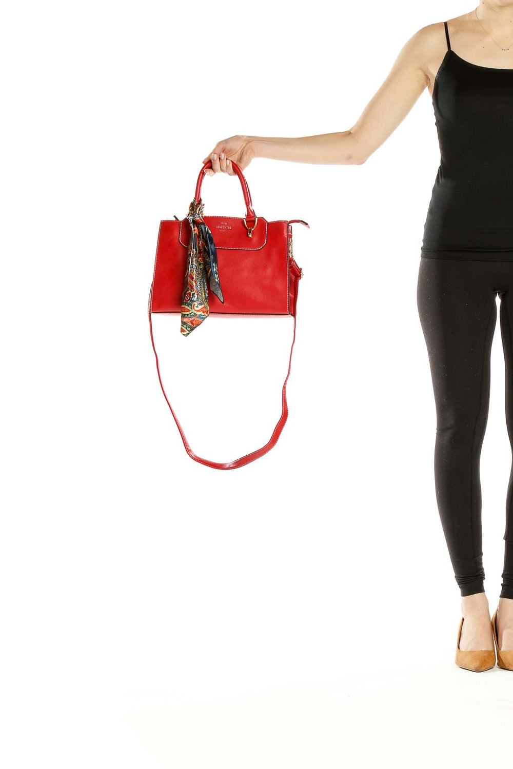 Front view of red leather London Fog crossbody bag with colorful scarf accent