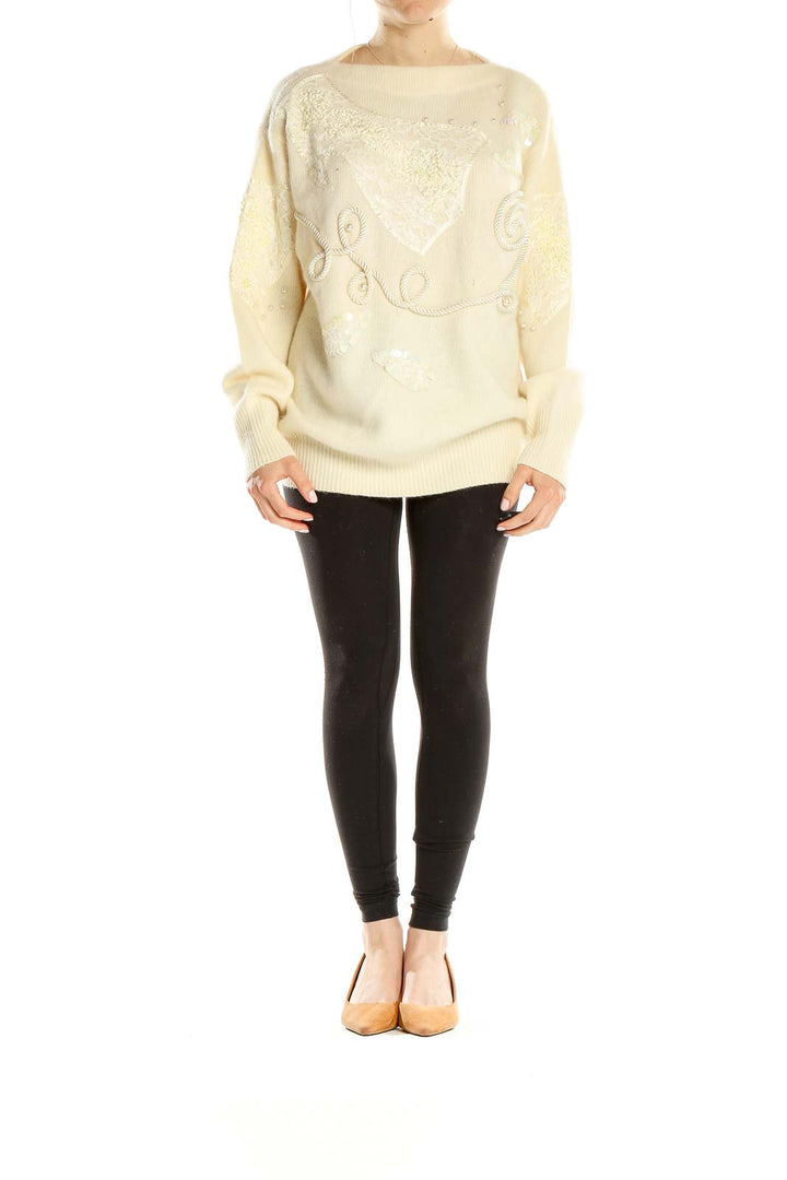 Front view of cream Apart oversized knit sweater with sequin embellishments and rope embroidery