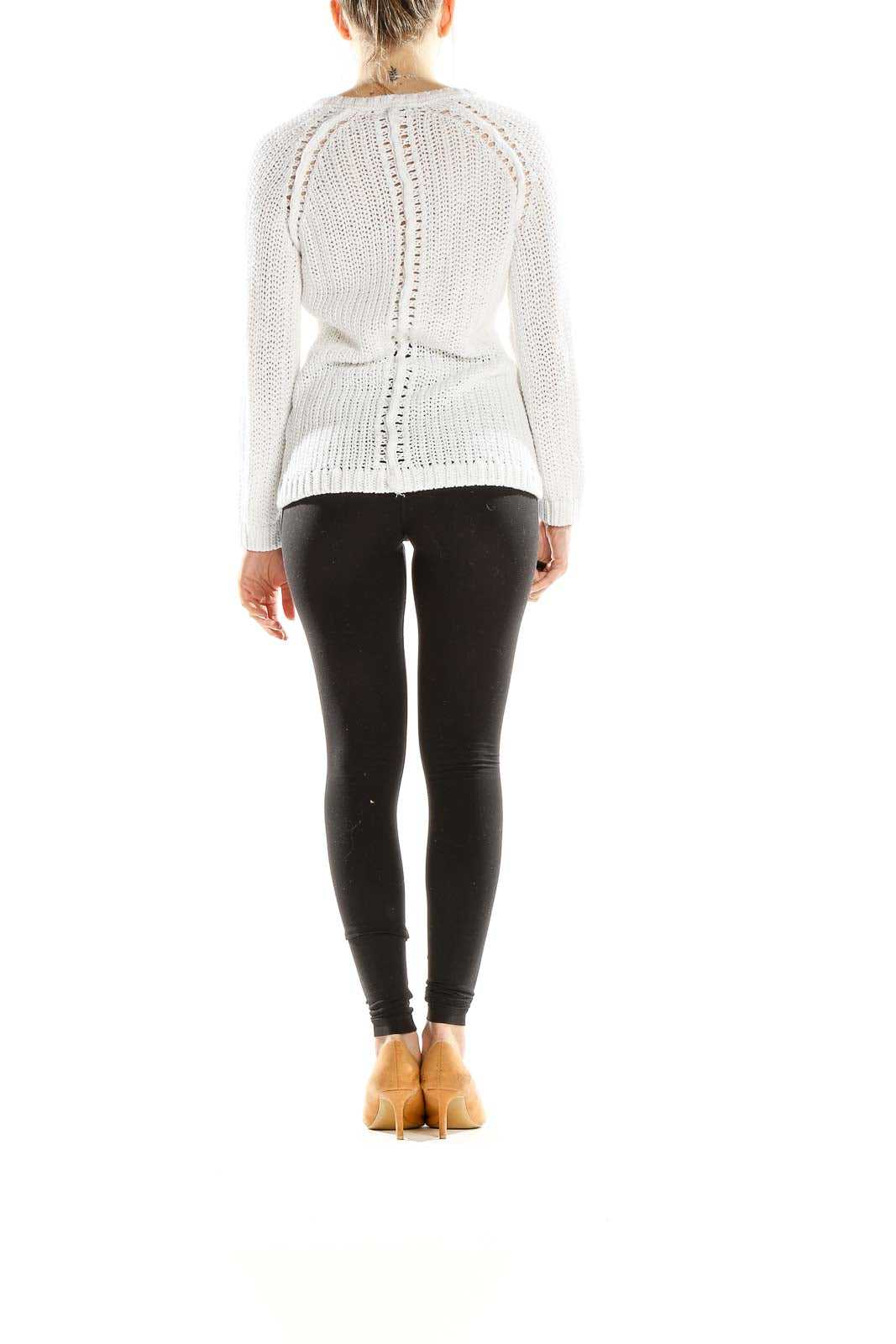 Side view of white V-neck knit sweater from Ann Taylor LOFT on model