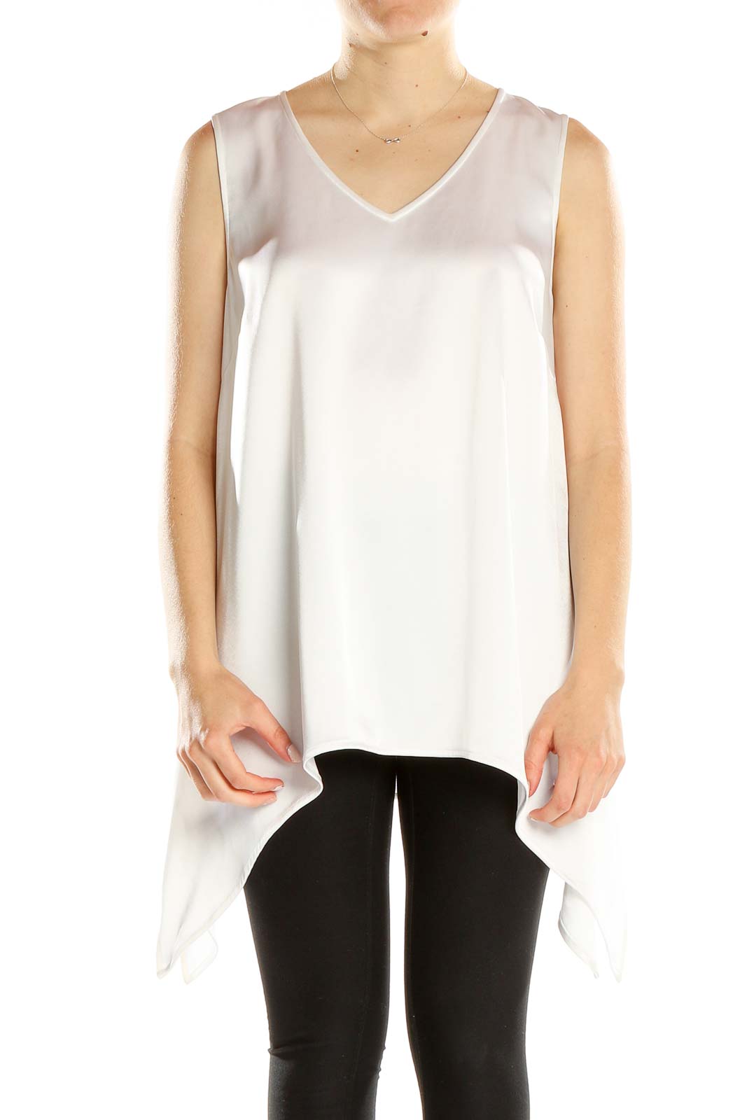 Front view of St. John Evening white sleeveless V-neck top with asymmetric hemline