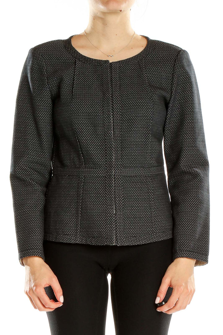 Front view of DKNY black textured zip-up jacket with subtle dot pattern