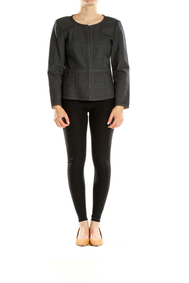 Front view of DKNY black textured zip-up jacket with subtle dot pattern