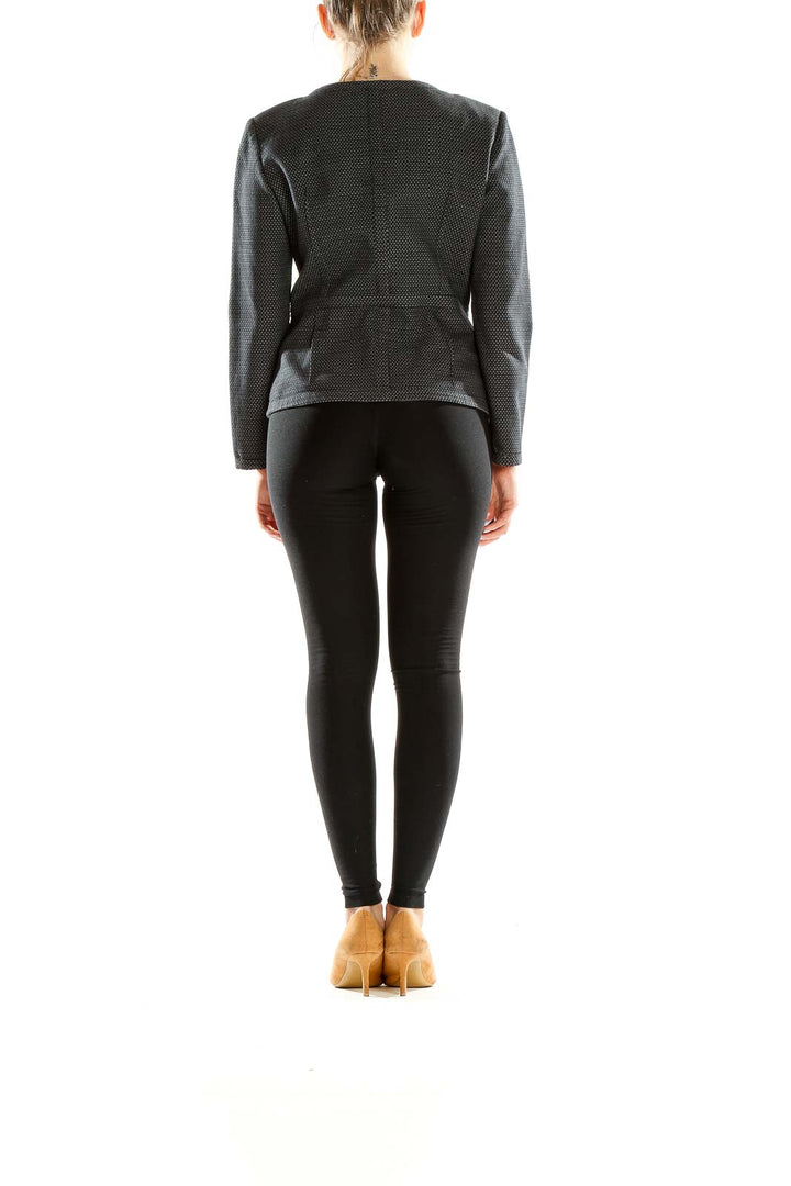 Back view of DKNY black textured zip-up jacket showing fitted silhouette
