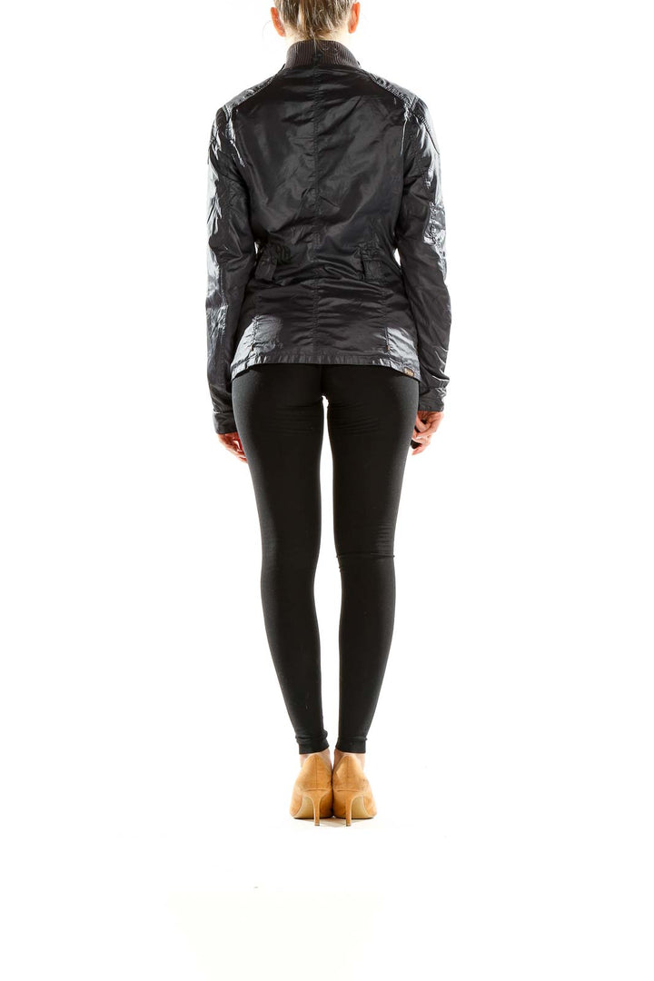 Side view of woman wearing G-Star Raw black lightweight jacket
