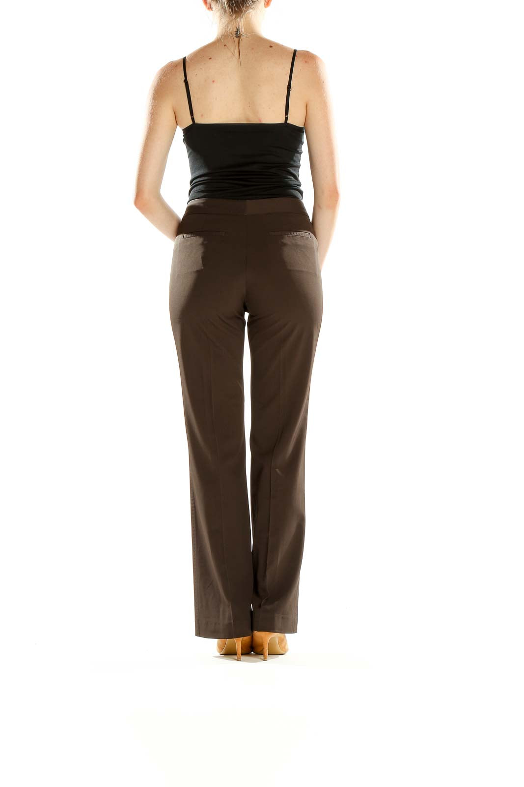 Side view of Tahari brown wide-leg trousers on model with black top