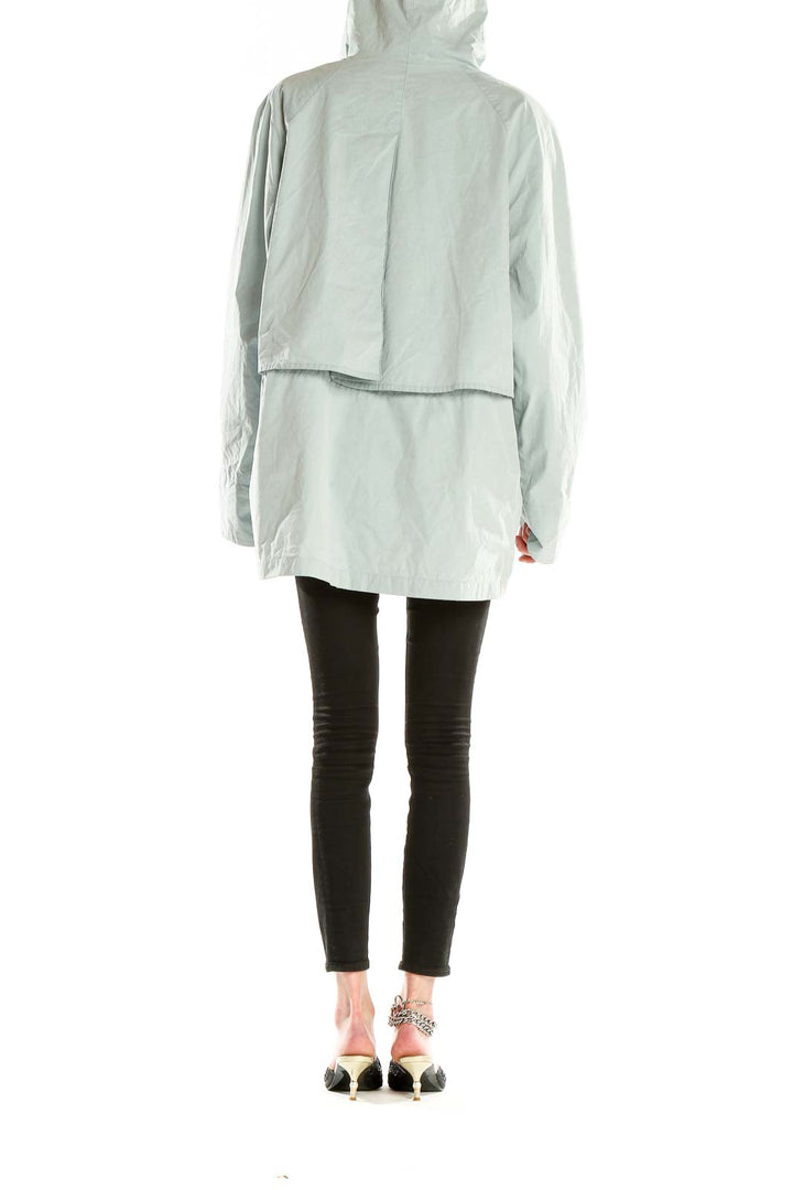 Back view of mint green Eddie Bauer hooded double-breasted jacket on model