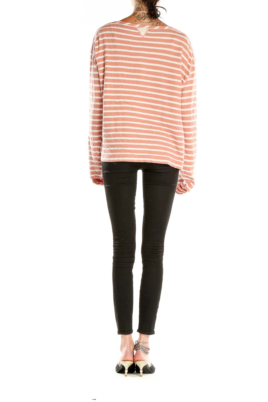 Side view of Alex Mill peach striped cotton long sleeve top on model