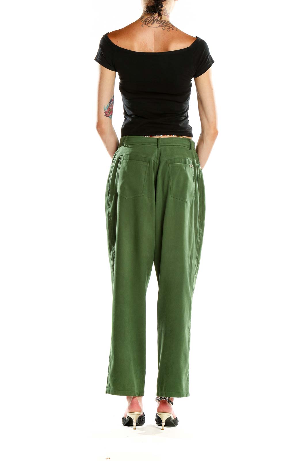 Side view of St. John Sport green high-waisted wide-leg trousers on model