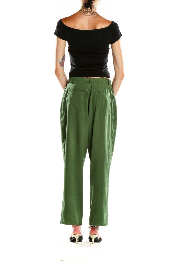 Side view of St. John Sport green high-waisted wide-leg trousers on model