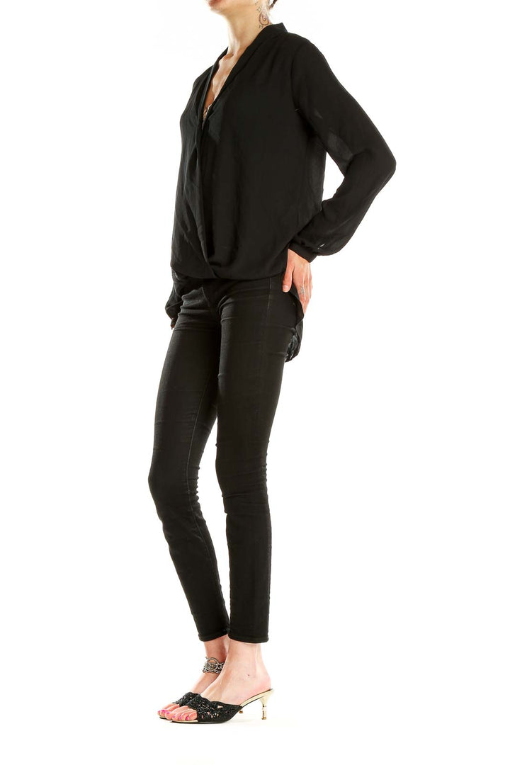 Front view of Max Studio black wrap blouse with V-neckline