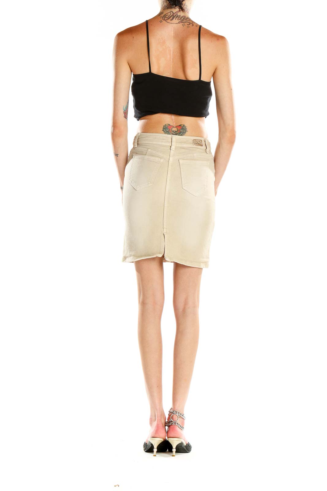 Side view of model wearing Vicky Couture beige denim pencil skirt