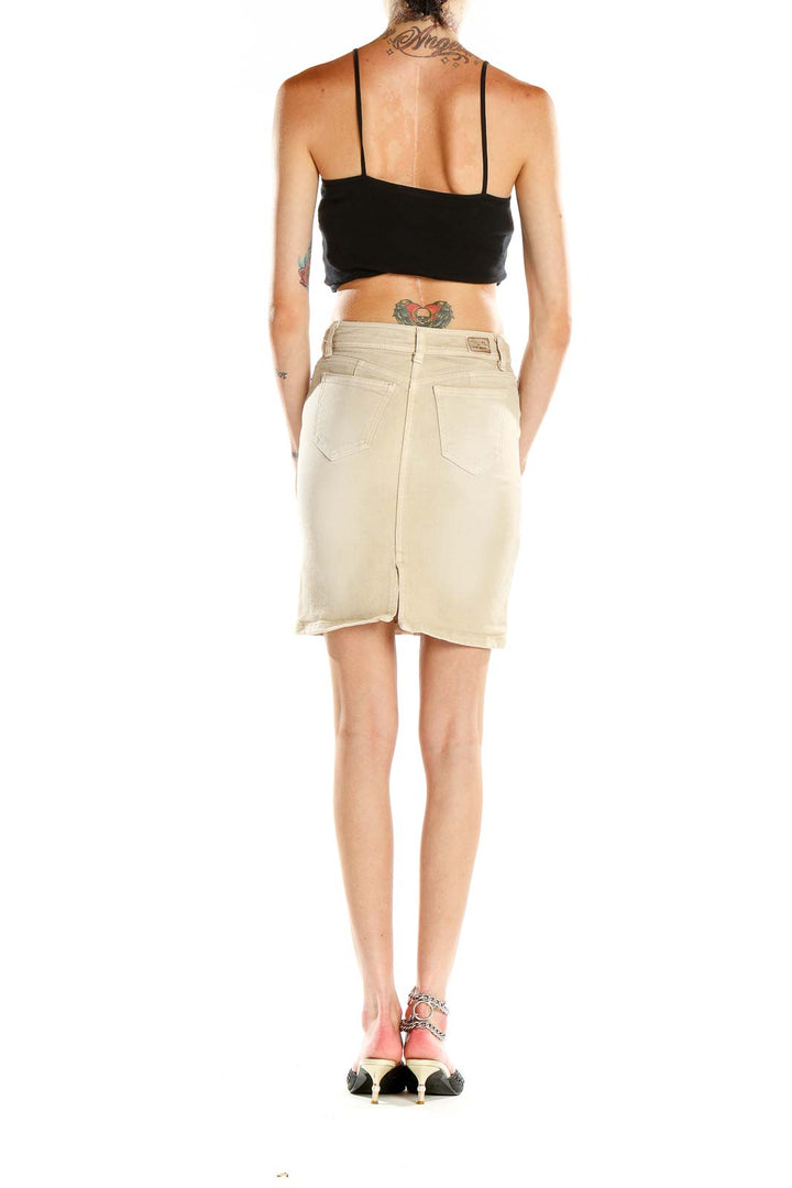 Side view of model wearing Vicky Couture beige denim pencil skirt