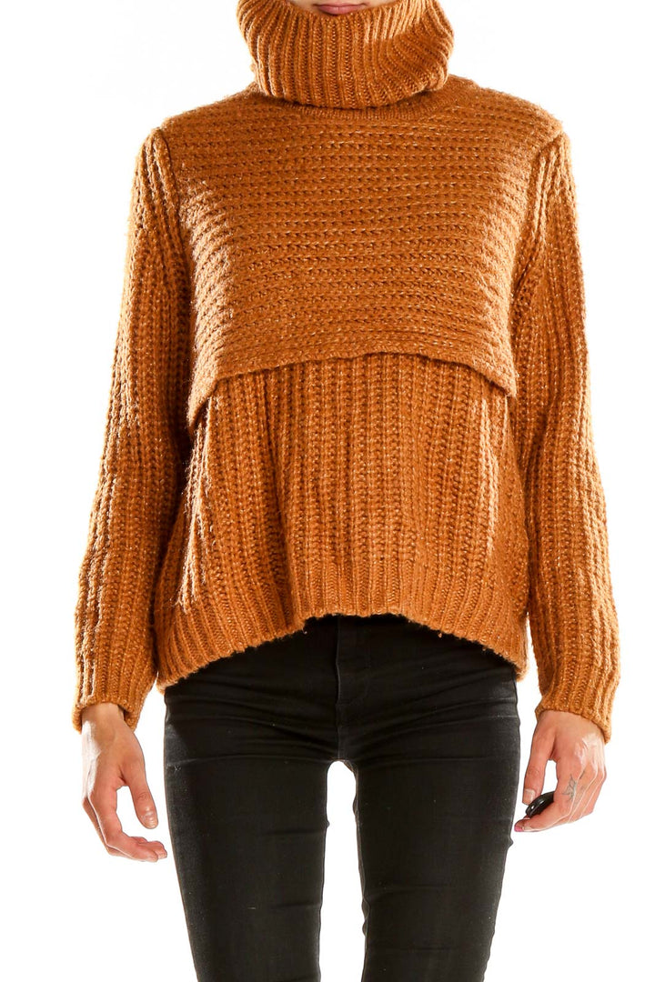 Front view of camel chunky knit turtleneck sweater with layered design