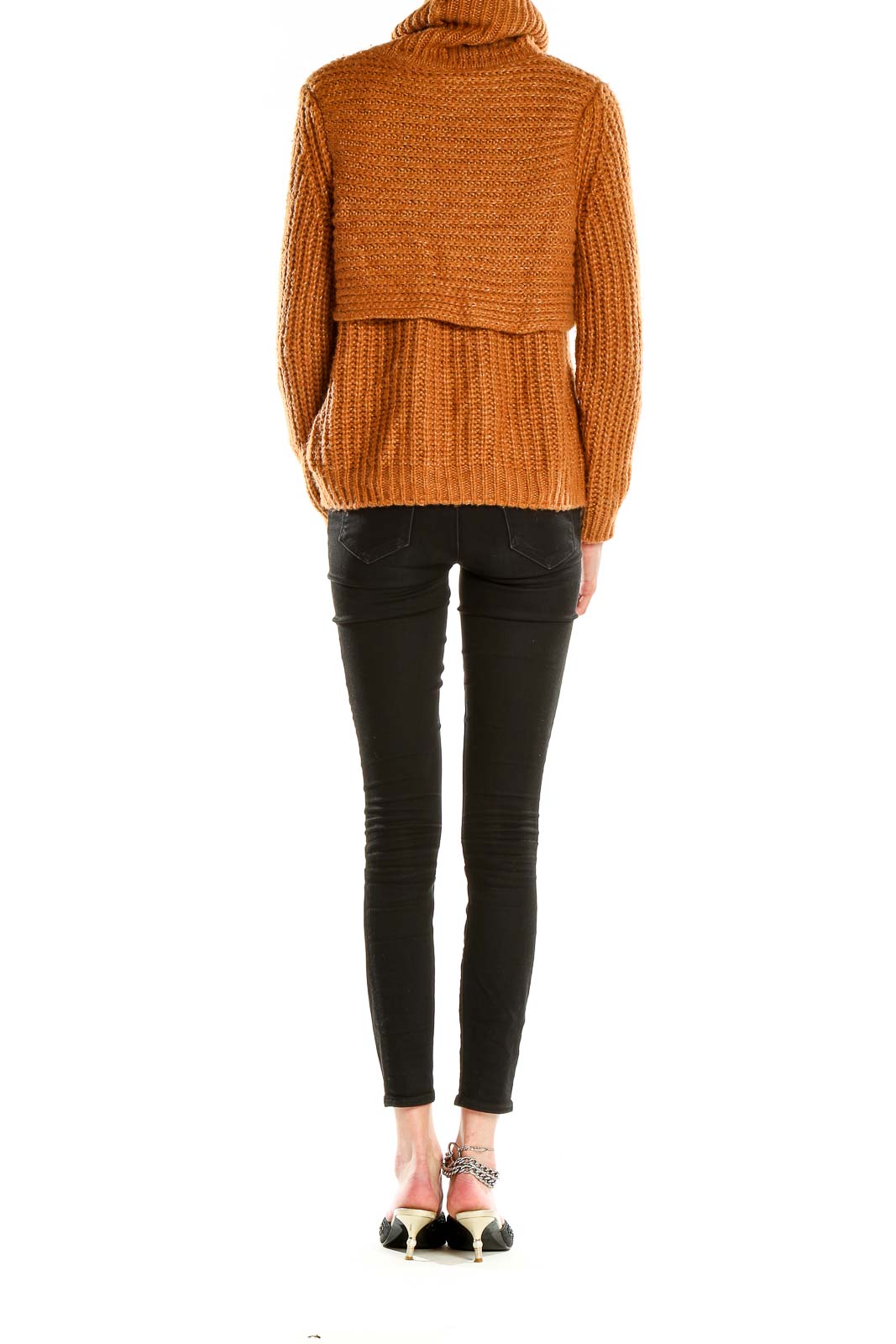 Side view of camel chunky knit turtleneck sweater showing layered design and fit