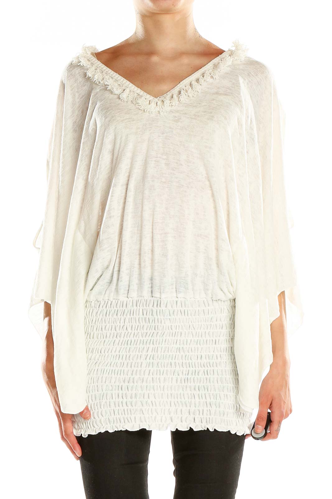 Front view of white fringe-trimmed tunic top with V-neckline and batwing sleeves