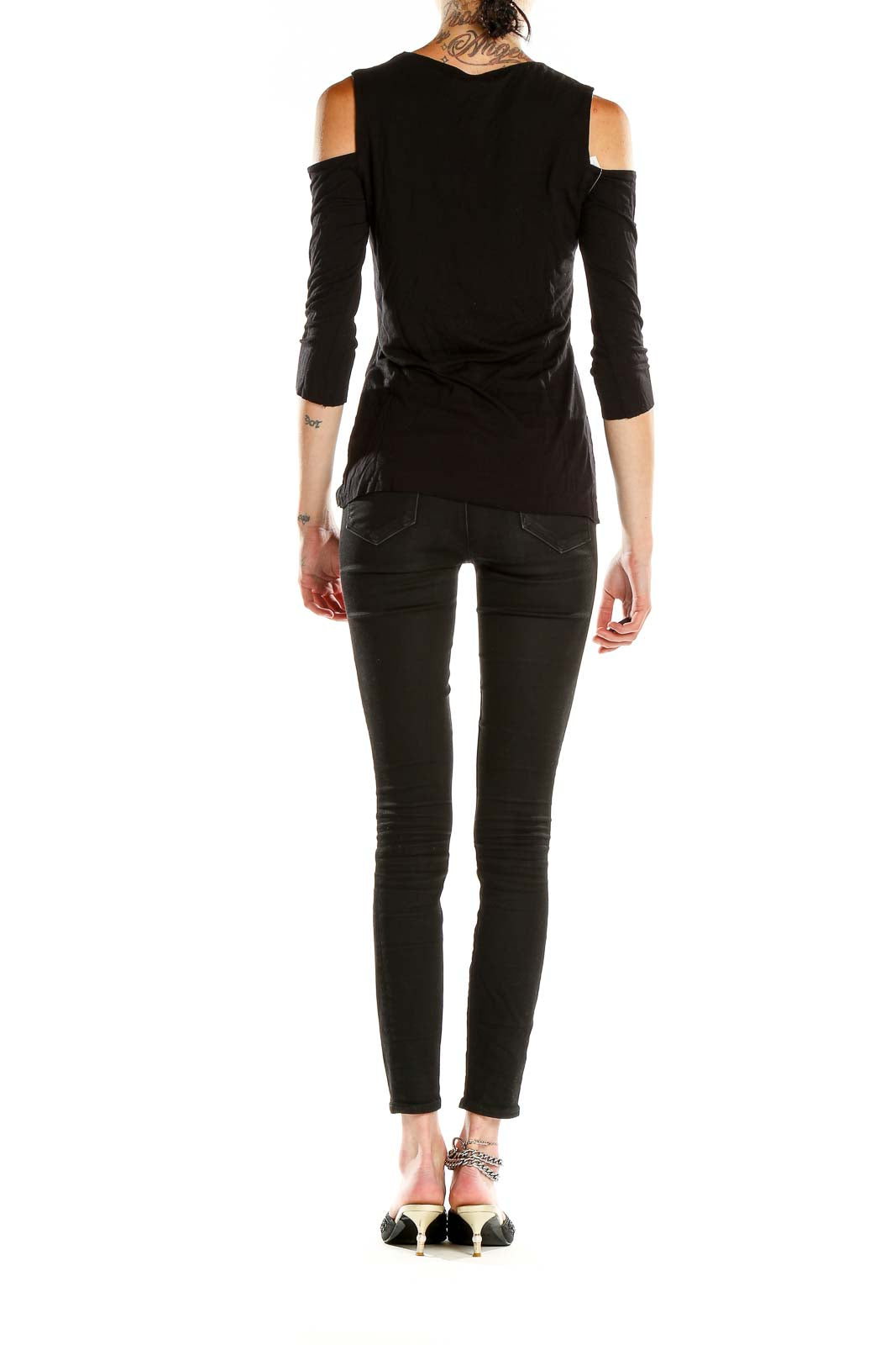 Side view of Bailey 44 black cold shoulder long sleeve top on model