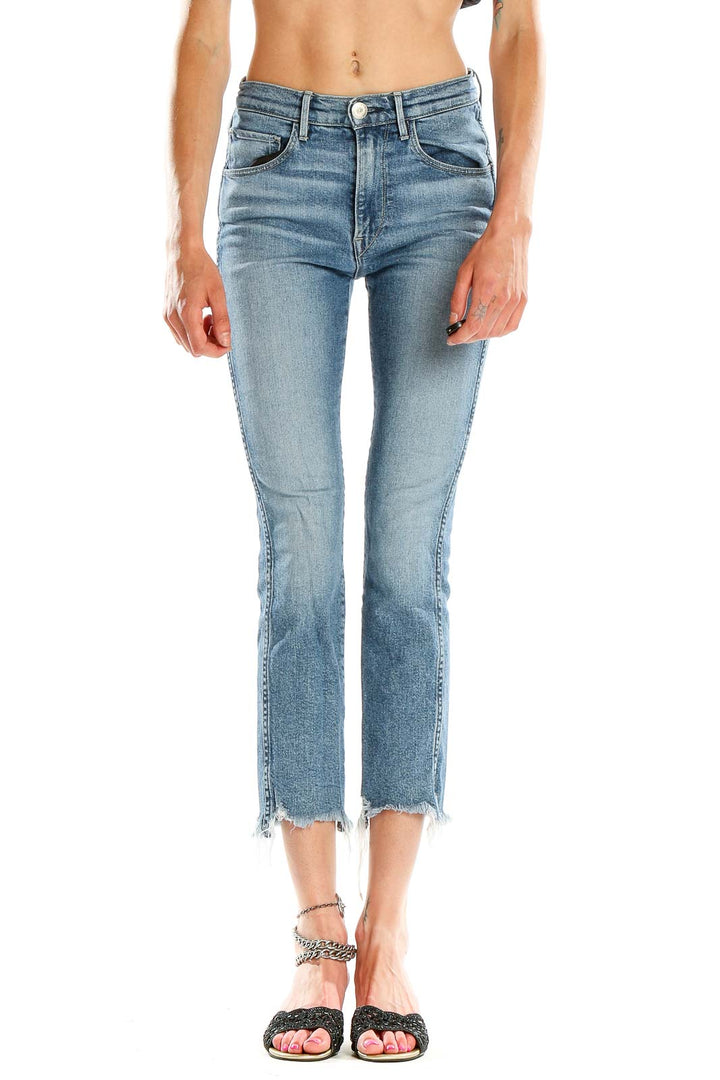 Front view of 3x1 Denim light blue cropped flare jeans with frayed hems