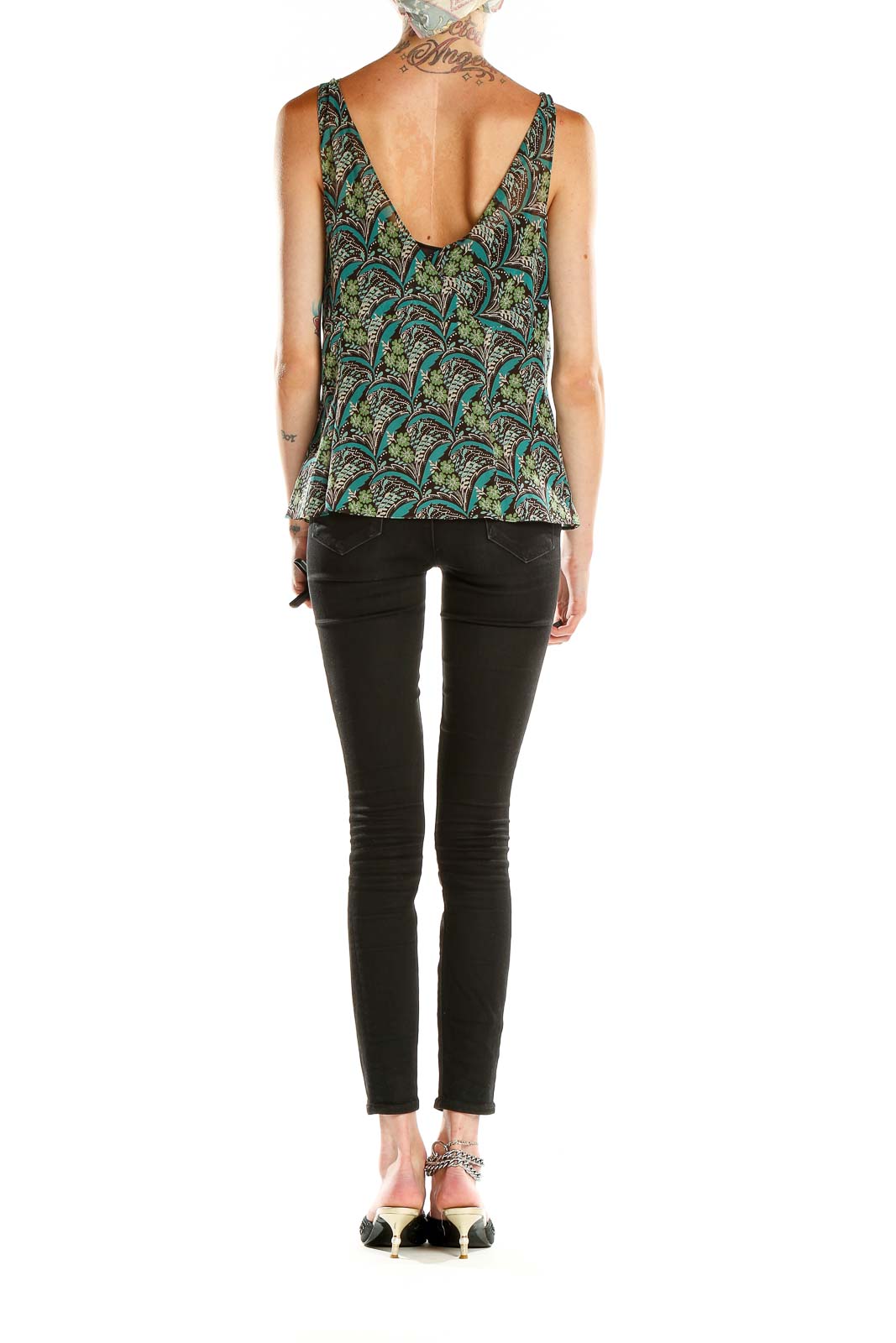 Side view of Ann Taylor LOFT green floral print V-neck tank top paired with black pants