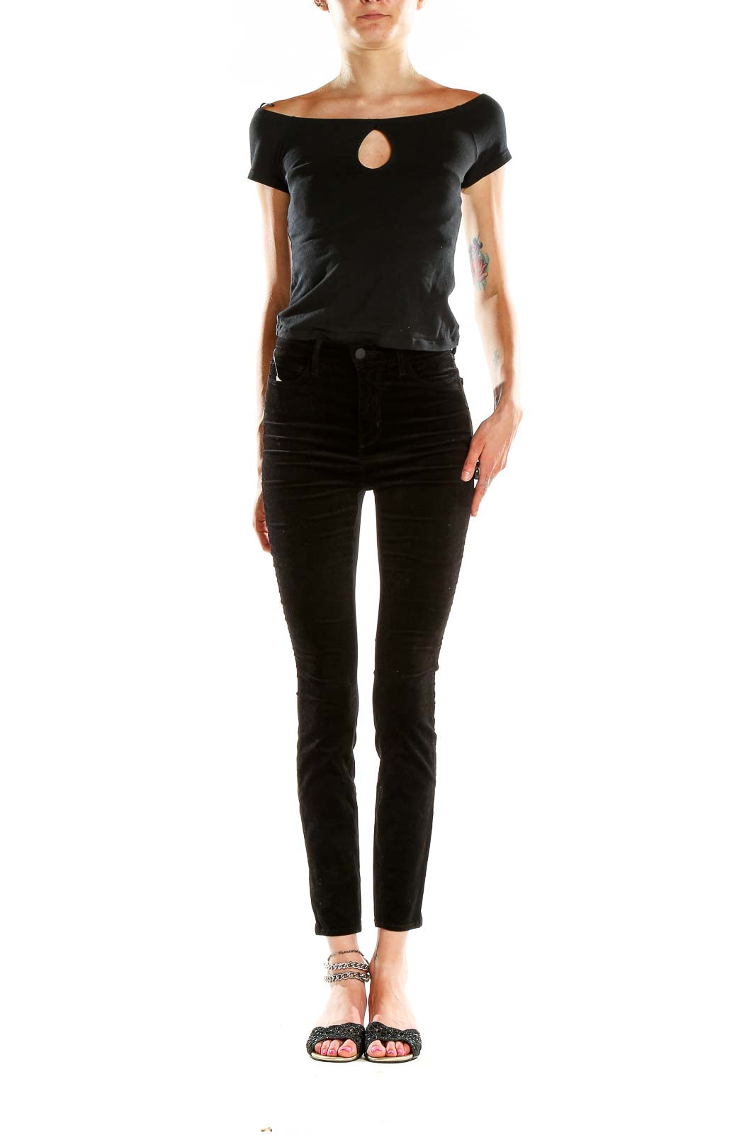 Front view of L'AGENCE black velvet high-waisted skinny pants on model