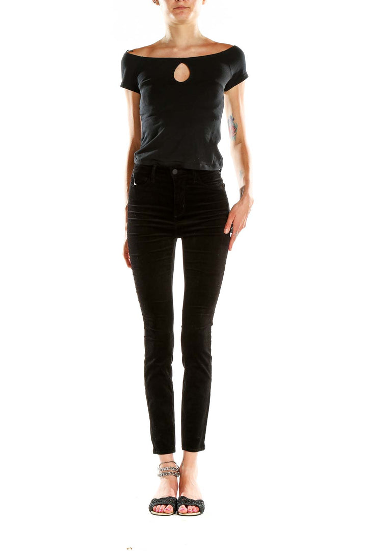 Front view of L'AGENCE black velvet high-waisted skinny pants on model