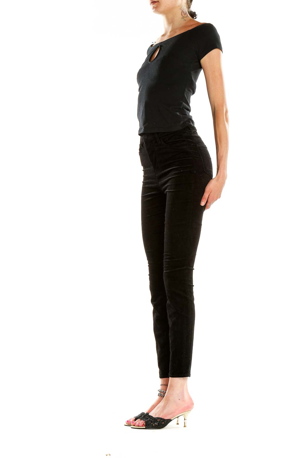 Front view of L'AGENCE black velvet high-waisted skinny pants on model