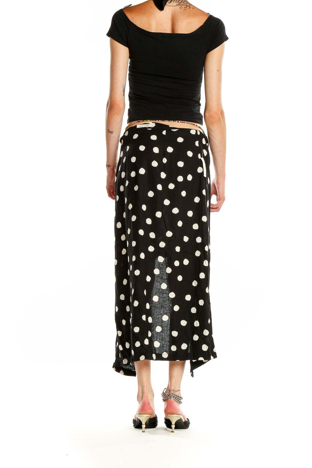 Side view of Urban Outfitters Black and White Polka Dot Maxi Skirt showing waistband and length