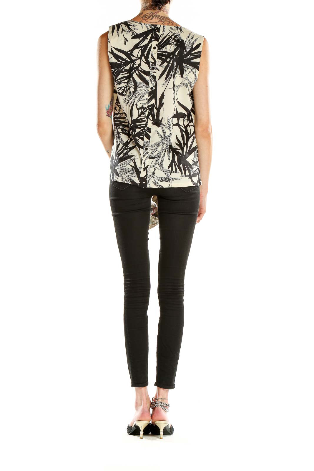 Side view of Linea Domani Black and White Tropical Print Sleeveless Top on model
