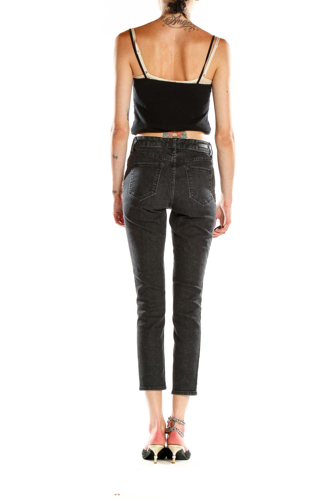 Back view of Sanctuary black cropped skinny jeans on model