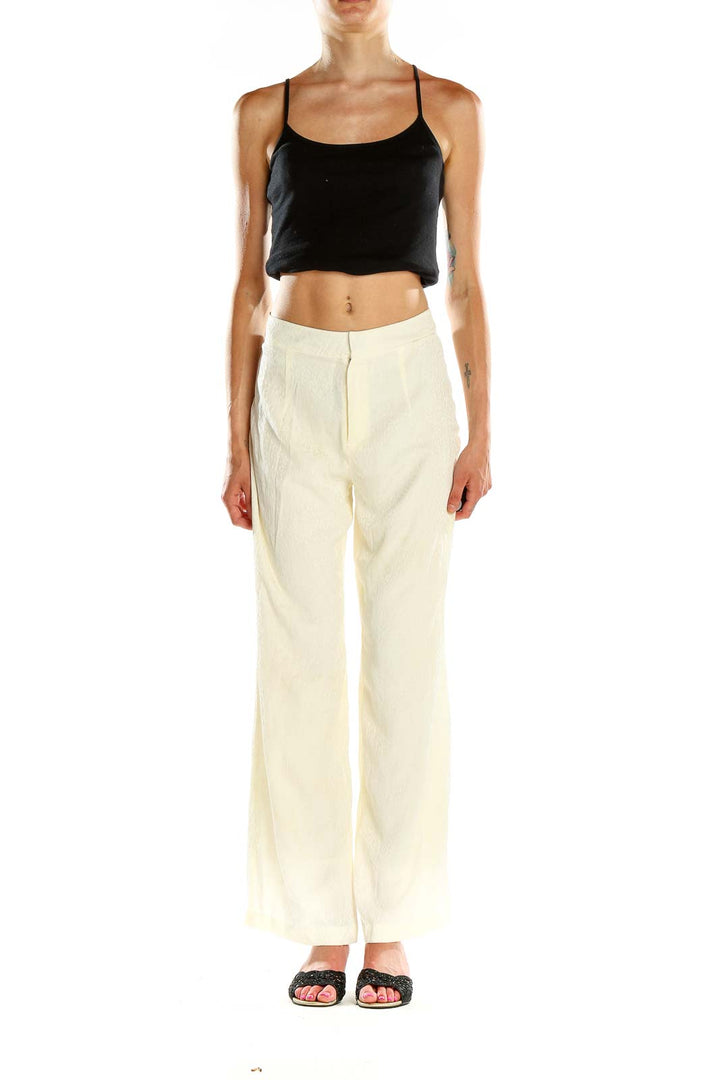 Front view of Blue Life cream wide-leg linen trousers on model