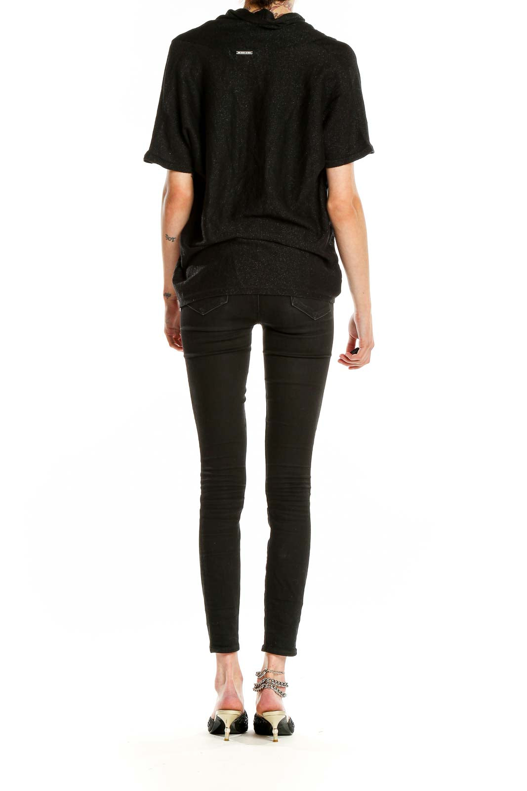 Side view of black MICHAEL Michael Kors draped V-neck short sleeve top on model