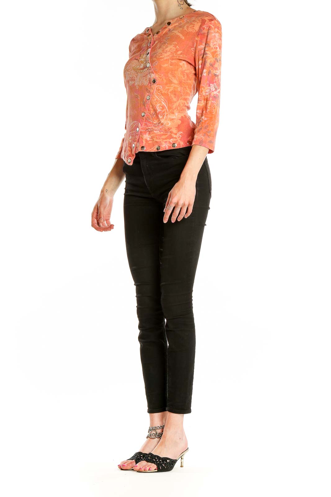 Front view of Boho Chic coral floral asymmetric button-up top