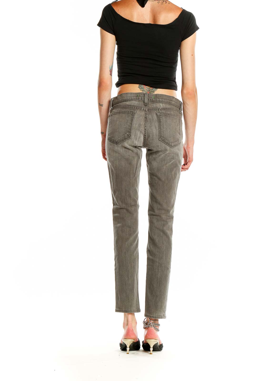Back view of J Brand gray straight leg jeans on model with black crop top