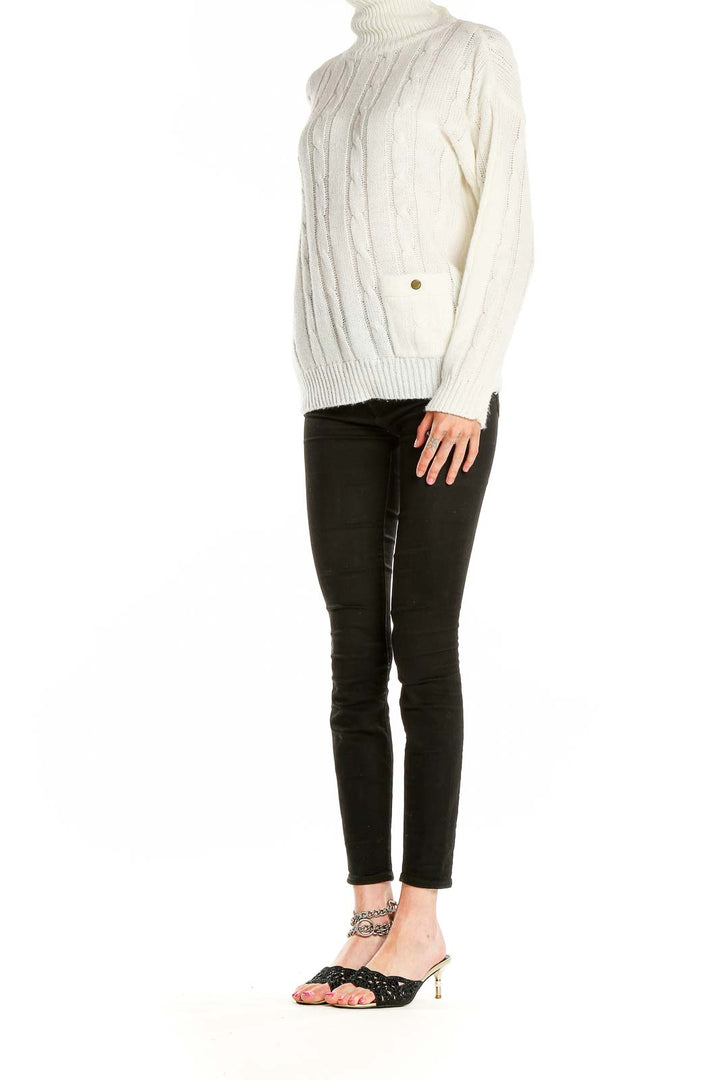 Front view of Nan Dorsey cream cable knit turtleneck sweater
