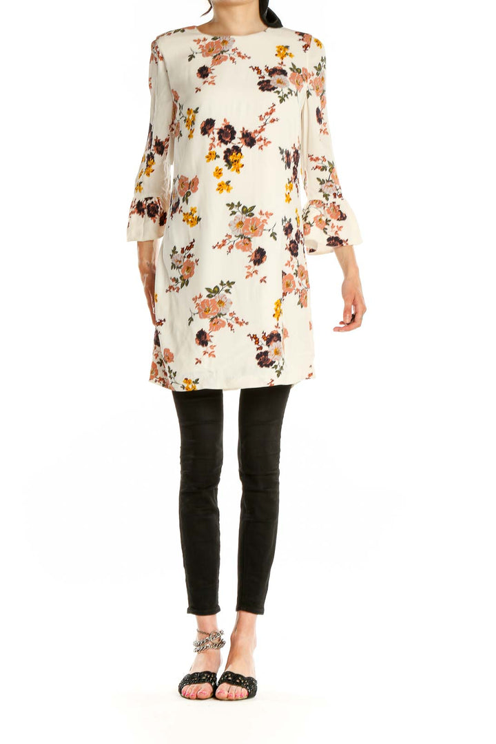 Front view of Sanctuary cream floral mini dress with bell sleeves